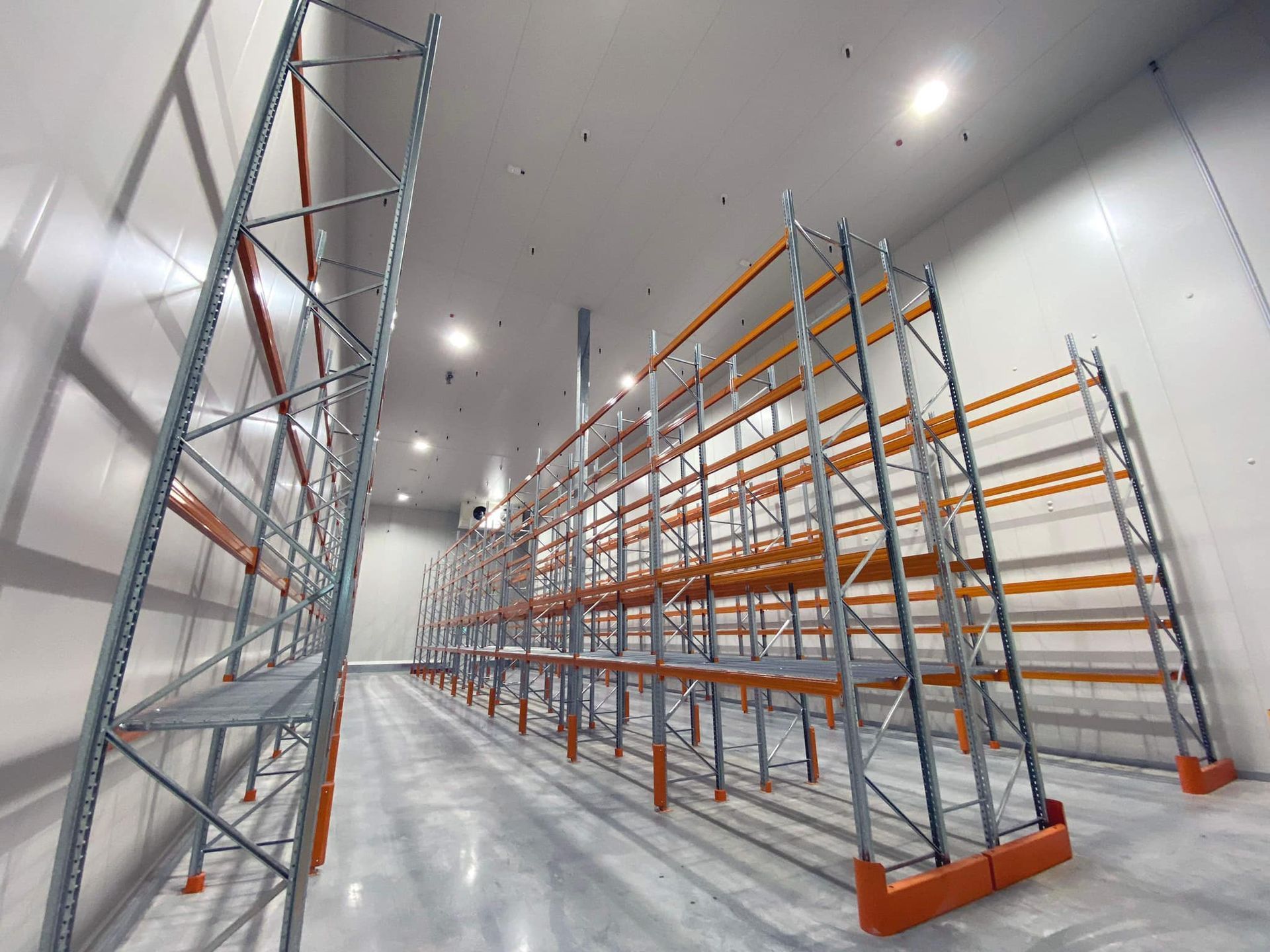 A Room with Stainless Steel Shelves and A Refrigerator — Arctic Installations in Winnellie, NT