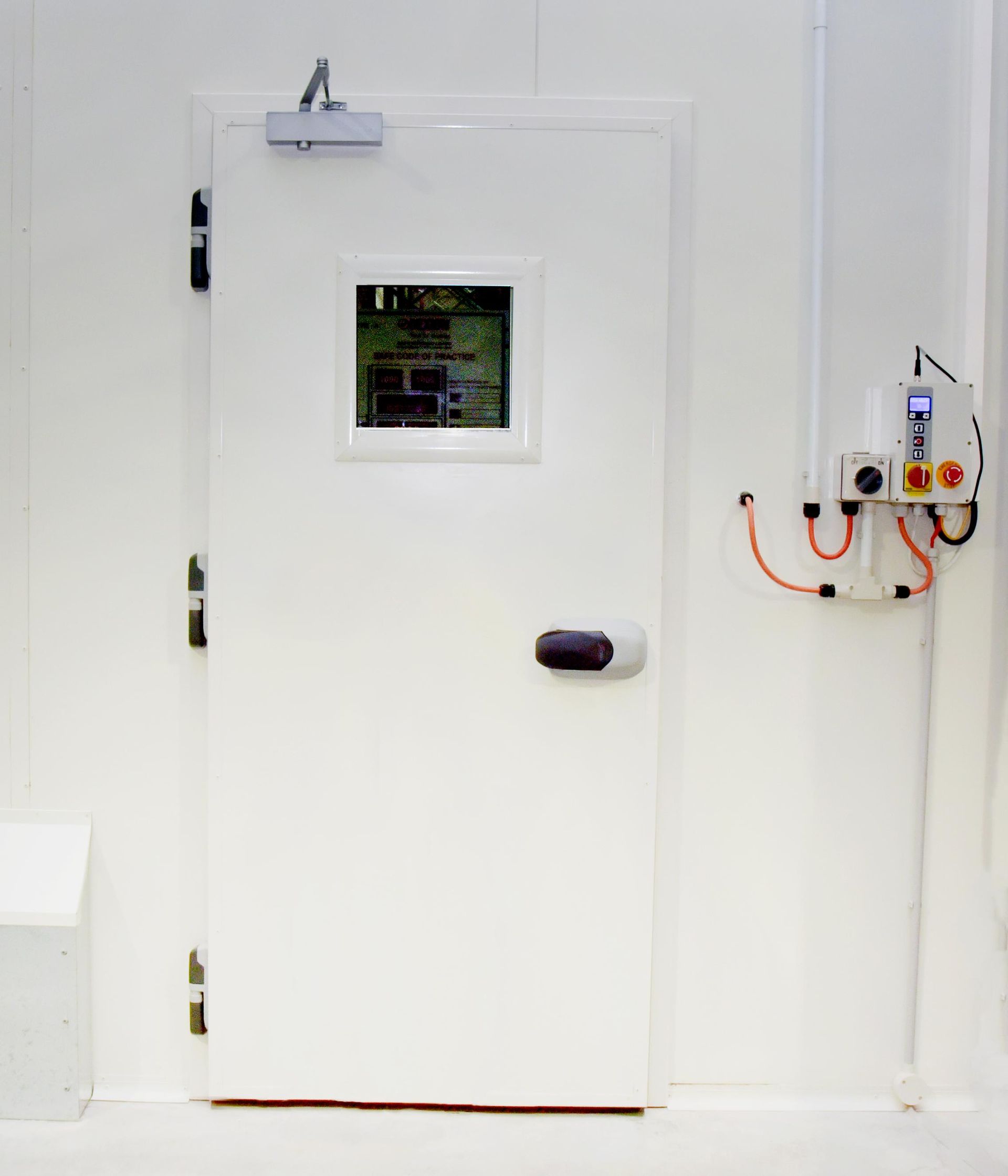 A White Door with A Small Window on It in A Room — Arctic Installations in Winnellie, NT