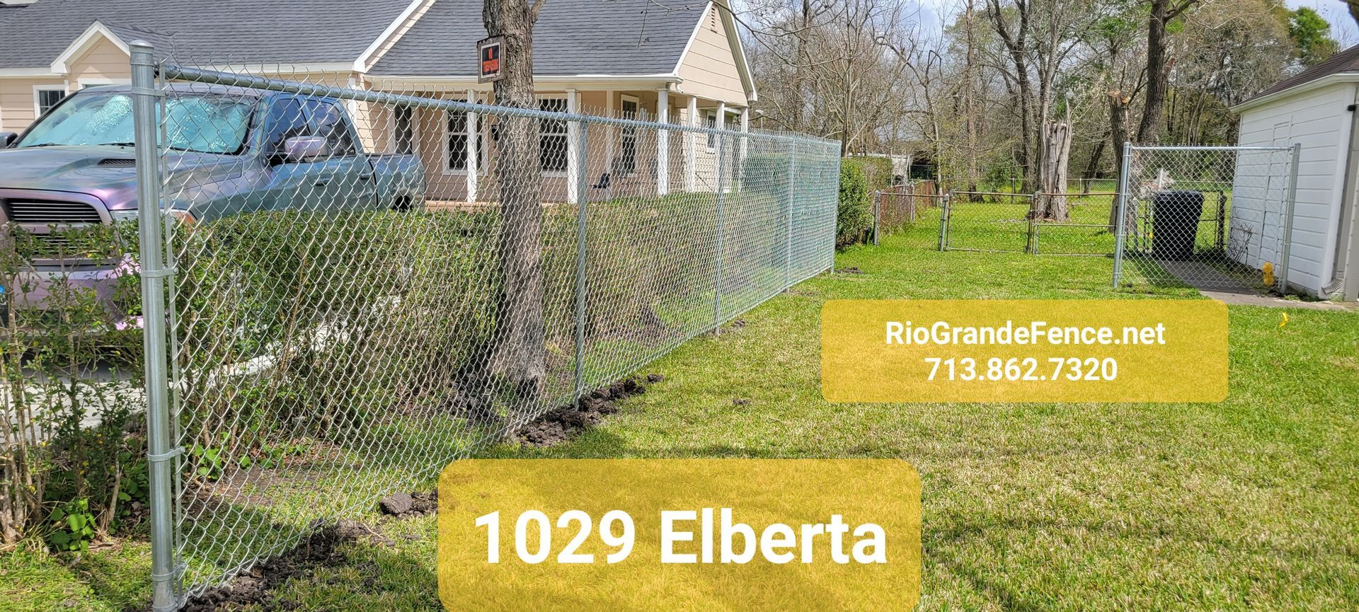 A Chain Link Fence Is Being Installed in Front of A House - Houston, TX - Rio Grande Fence Company