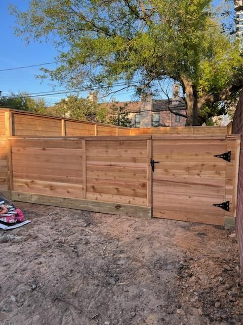 A Wooden Fence With A Gate in The Backyard - Houston, TX - Rio Grande Fence Company