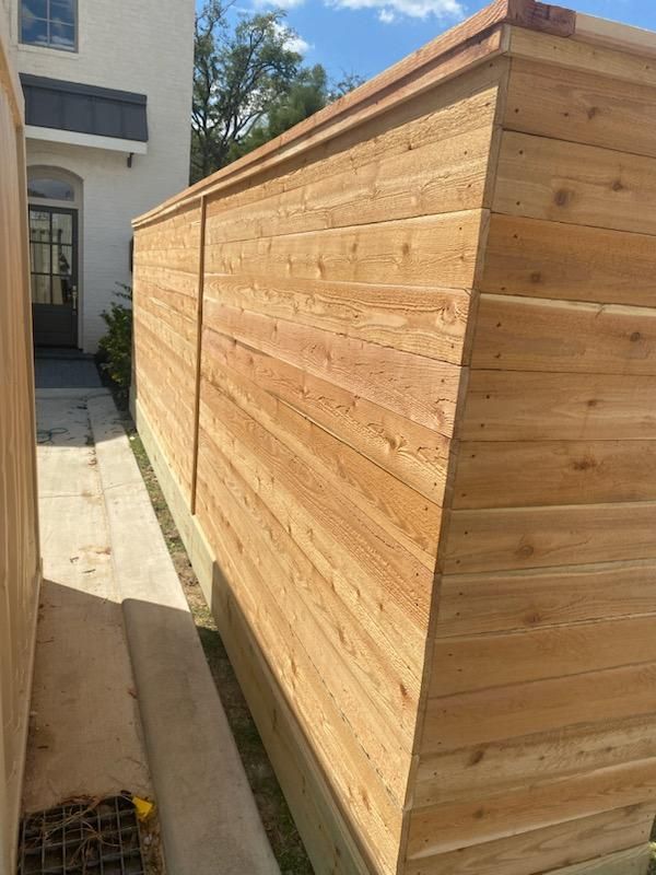 A Wooden Fence Is Sitting in Front of A House - Houston, TX - Rio Grande Fence Company