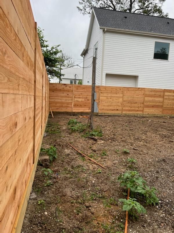 There Is a Wooden Fence in The Backyard of A House - Houston, TX - Rio Grande Fence Company
