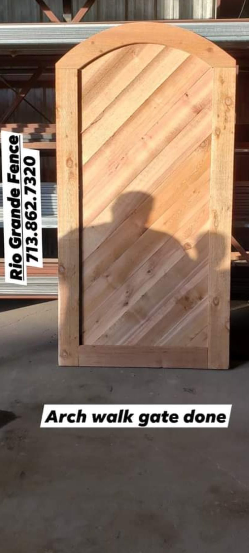 A Wooden Arch Walk Gate Is Sitting on The Ground - Houston, TX - Rio Grande Fence Company