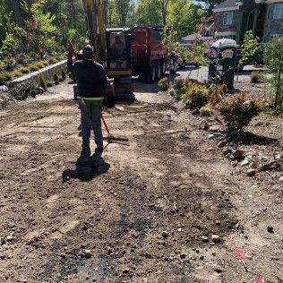 A residential driveway installation in Canton MA - Norfolk Asphalt Paving & Excavation hard at work