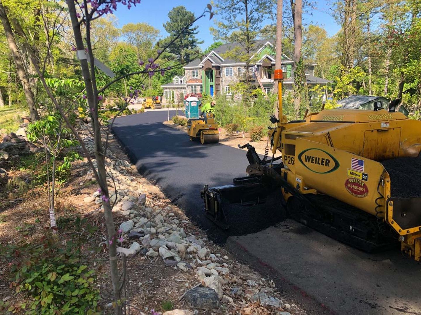 An asphalt driveway construction in Canton, MA by Norfolk Asphalt Paving & Excavation 