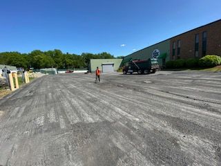 A before shot of a commercial asphalt service in Canton, MA by Norfolk Asphalt Paving & Excavation