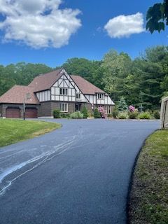 A residential asphalt driveway in Canton MA by Norfolk Asphalt Paving & Excavation