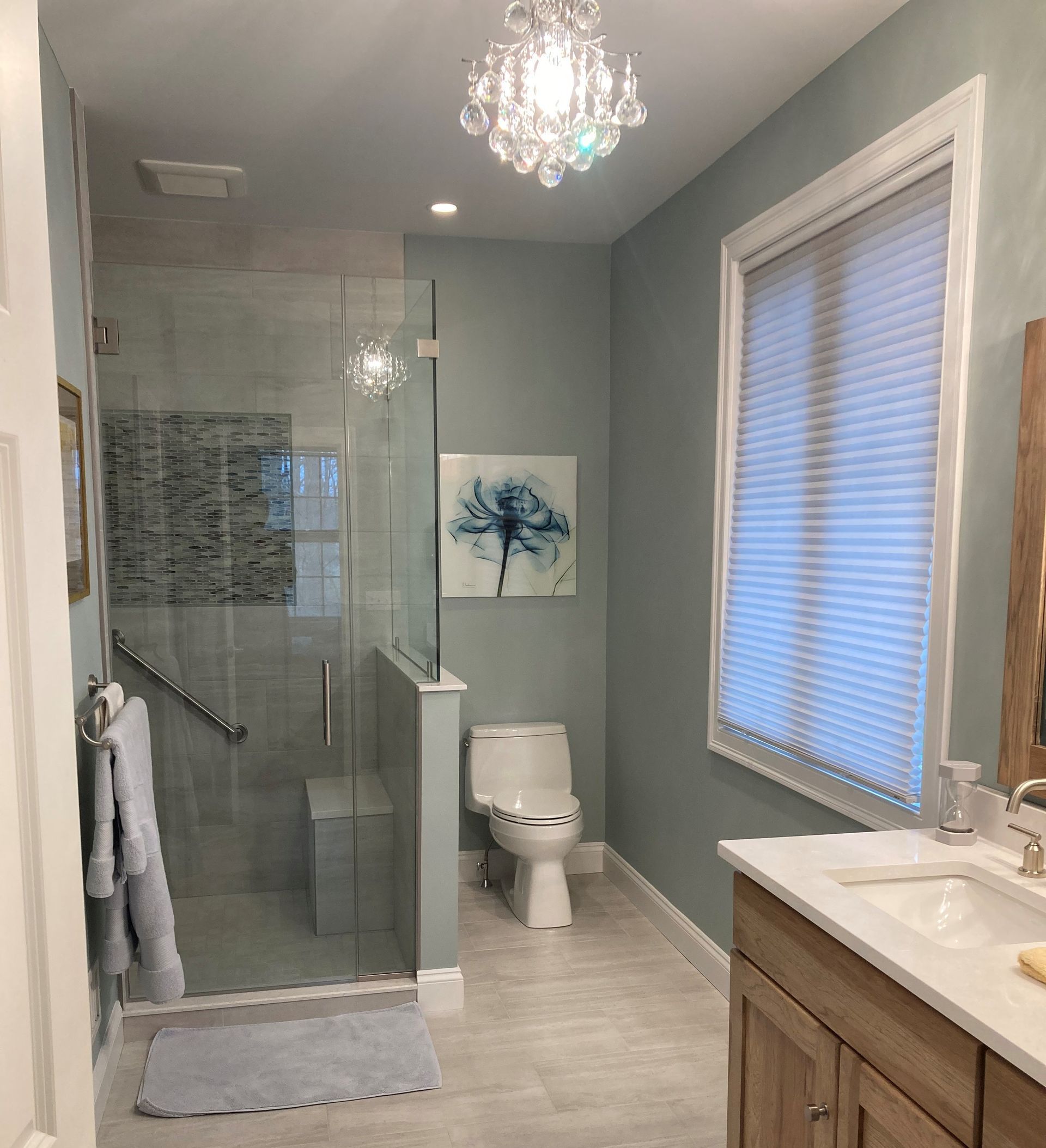 A bathroom with a bench – Guilford, CT - Red Door Kitchen & Bath Studio A bathroom with a bench – Guilford, CT - Red Door Kitchen & Bath Studio