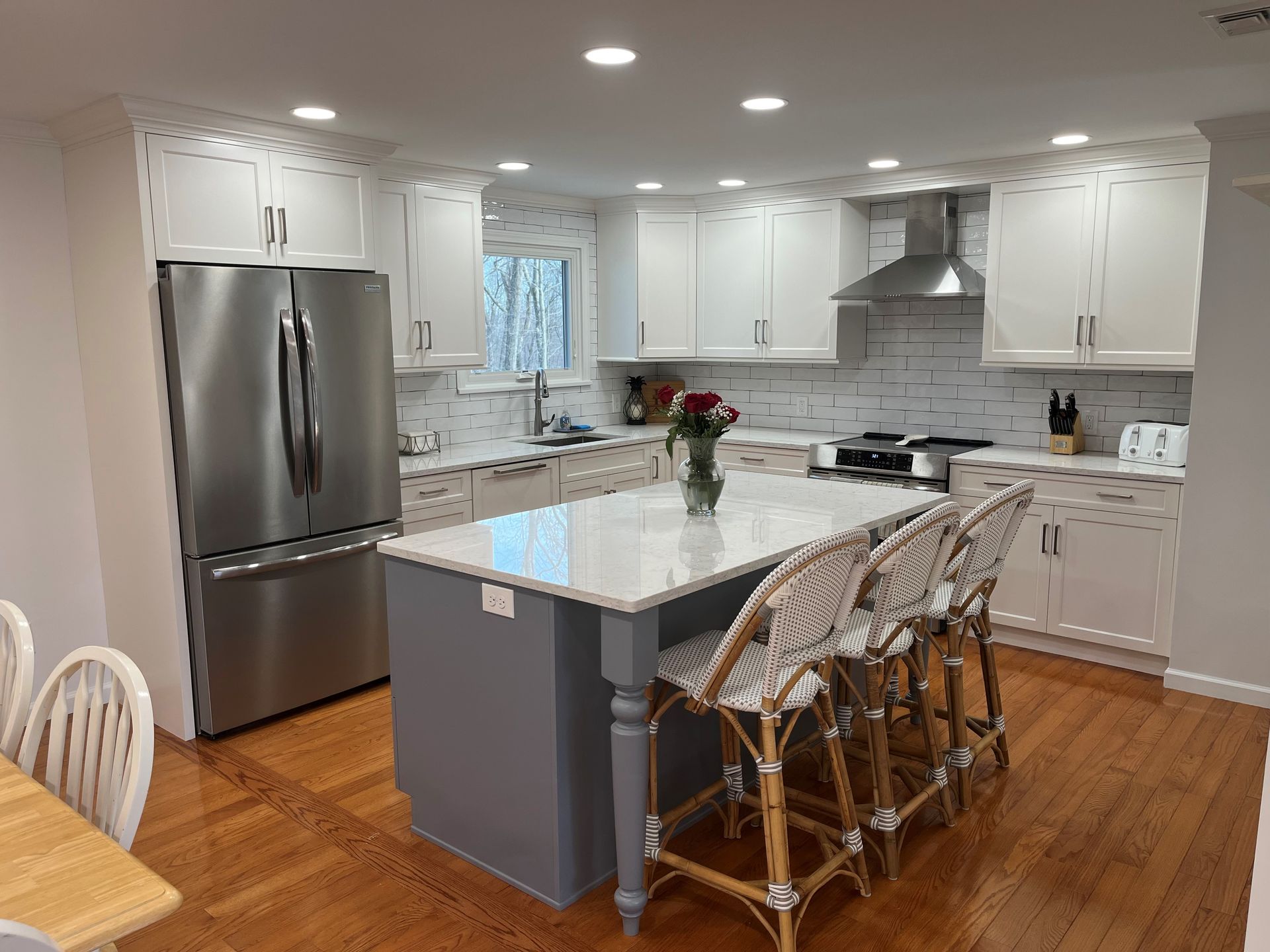 Scandinavian style cozy modern kitchen interior with a dining zone – Guilford, CT - Red Door Kitchen & Bath Studio Scandinavian style cozy modern kitchen interior with a dining zone – Guilford, CT - Red Door Kitchen & Bath Studio