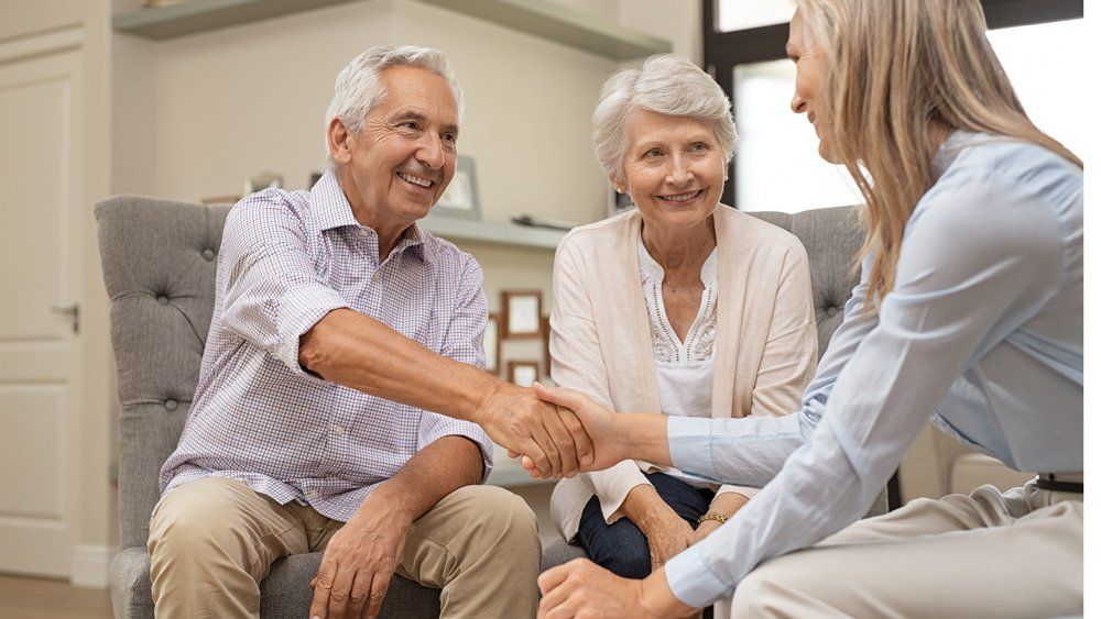 Senior Couple And Insurance Agent — Great Falls, MT — Senior Insurance Market Senior Couple And Insurance Agent — Great Falls, MT — Senior Insurance Market