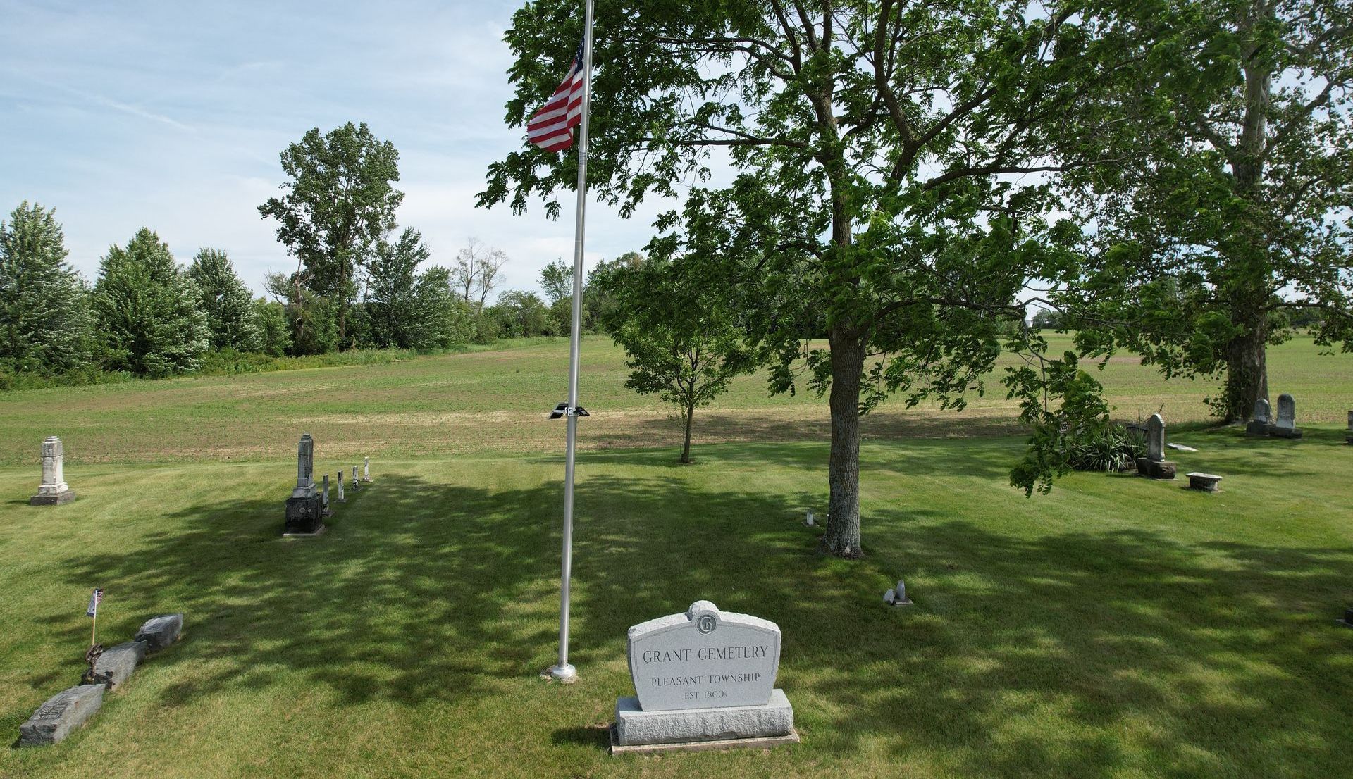 Grant Cemetery monument sign and American flag
