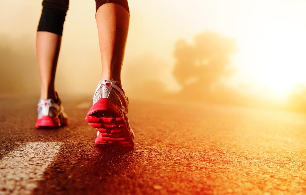 Athlete Running On Road — Quality Shoe Shop in Maroochydore, QLD