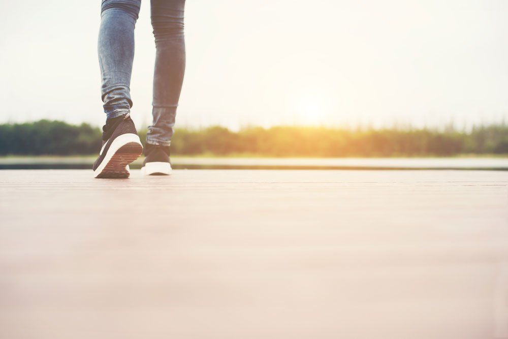 Woman Wearing Sneakers On Walk — Quality Shoe Shop in Maroochydore, QLD