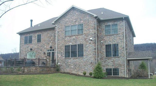 A large brick house with a lot of windows