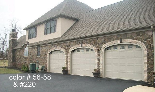 A Large House with Three Garage Doors and The Words Color # 56-58 & # 220