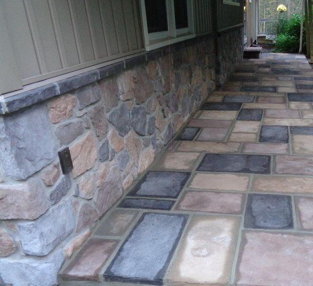 A Stone Walkway Along the Side of A House