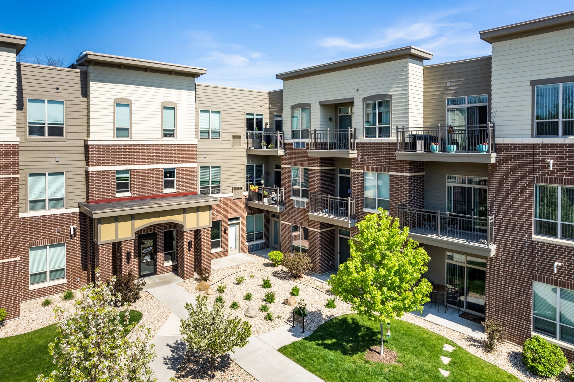 a large apartment building with a brick facade