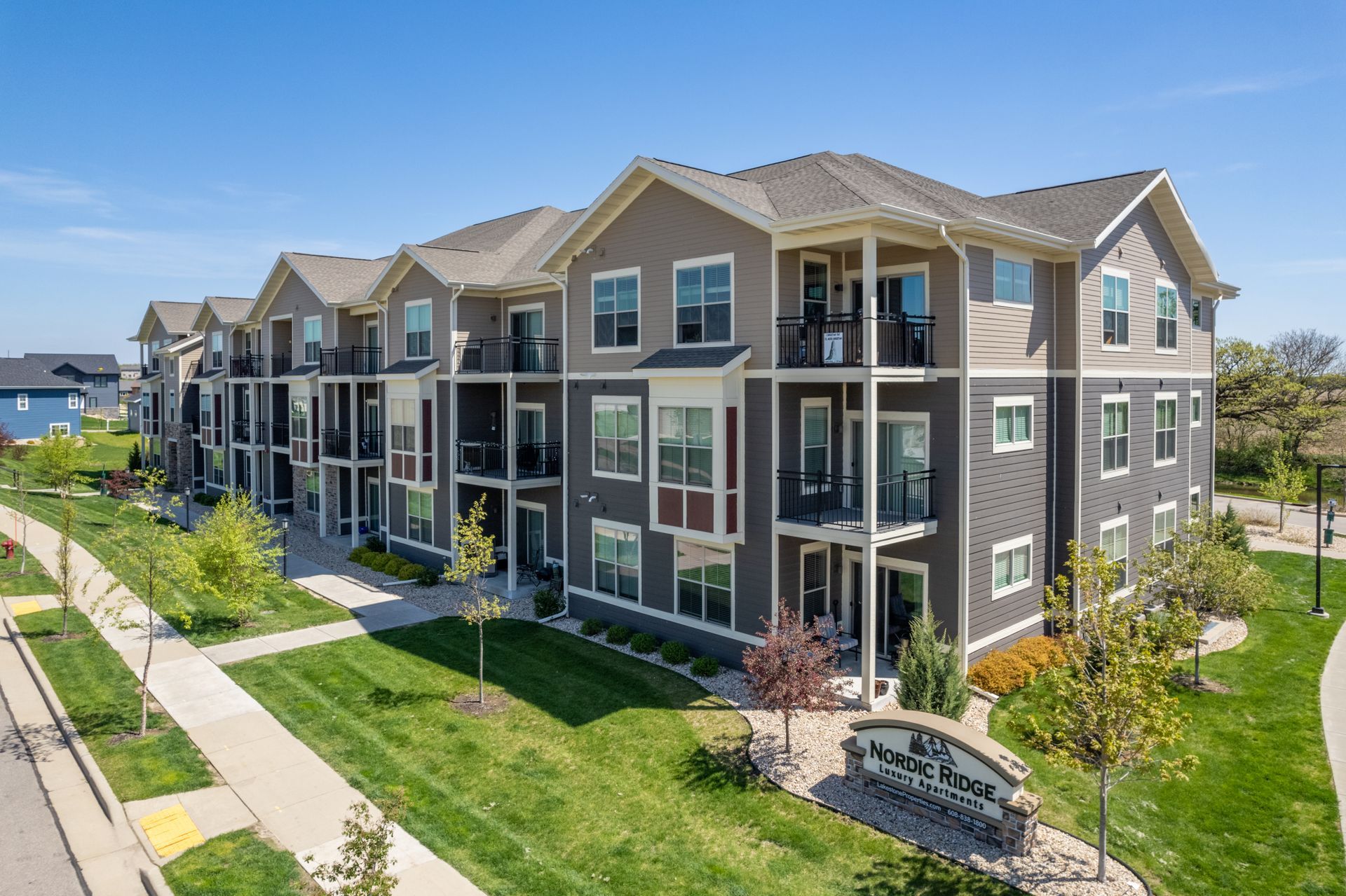 a large apartment building with a sign that says nordic ridge