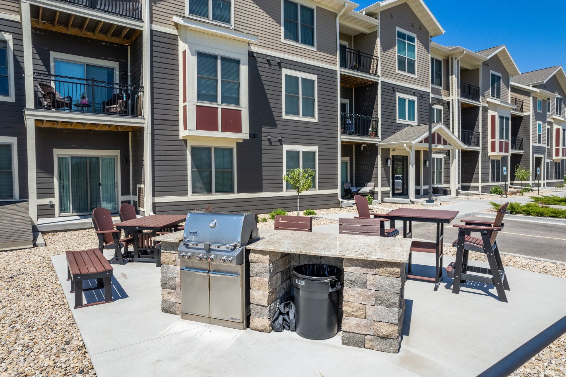 a stainless steel grill sits in front of a building