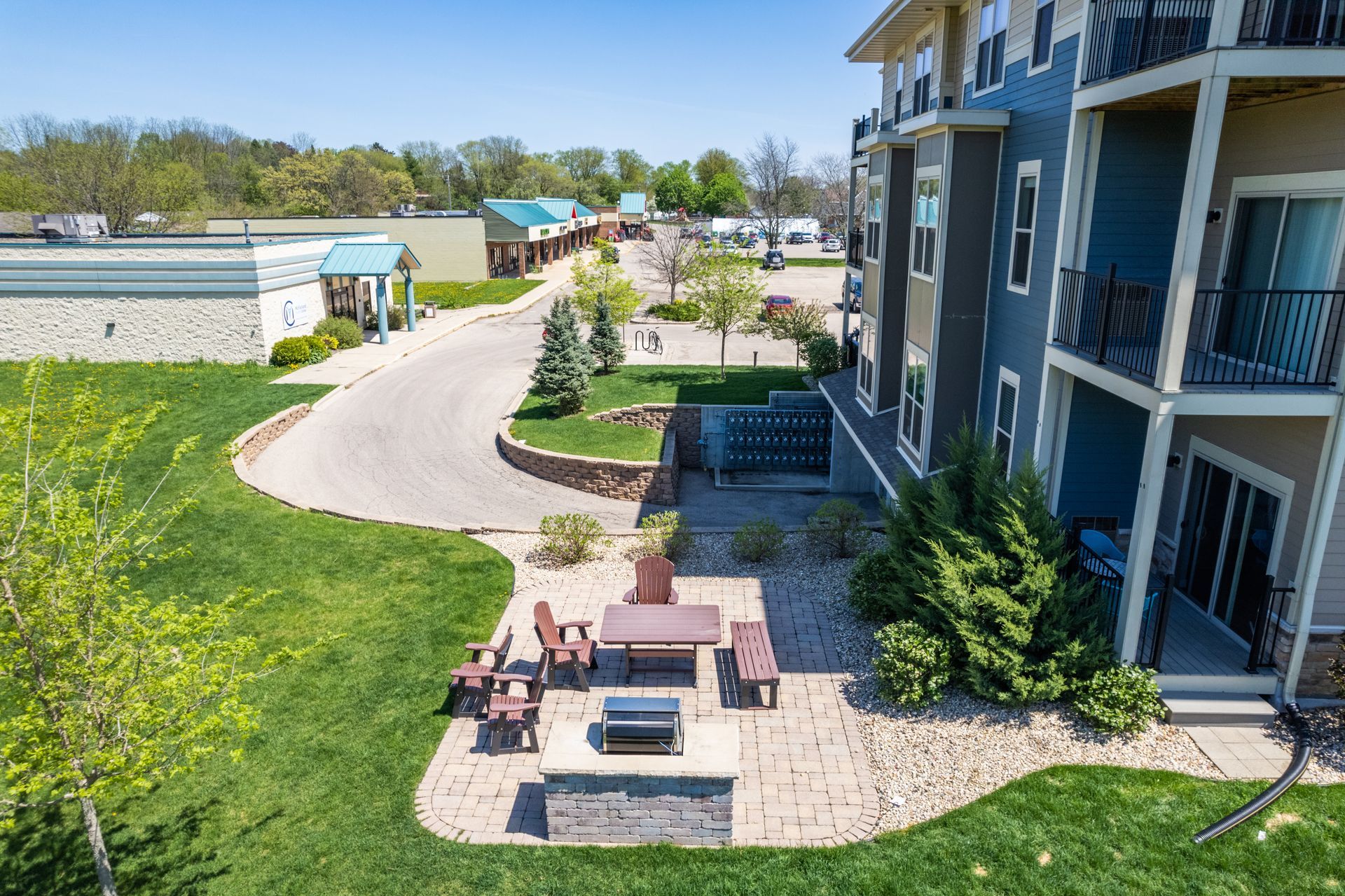 an aerial view of an apartment complex with a fire pit