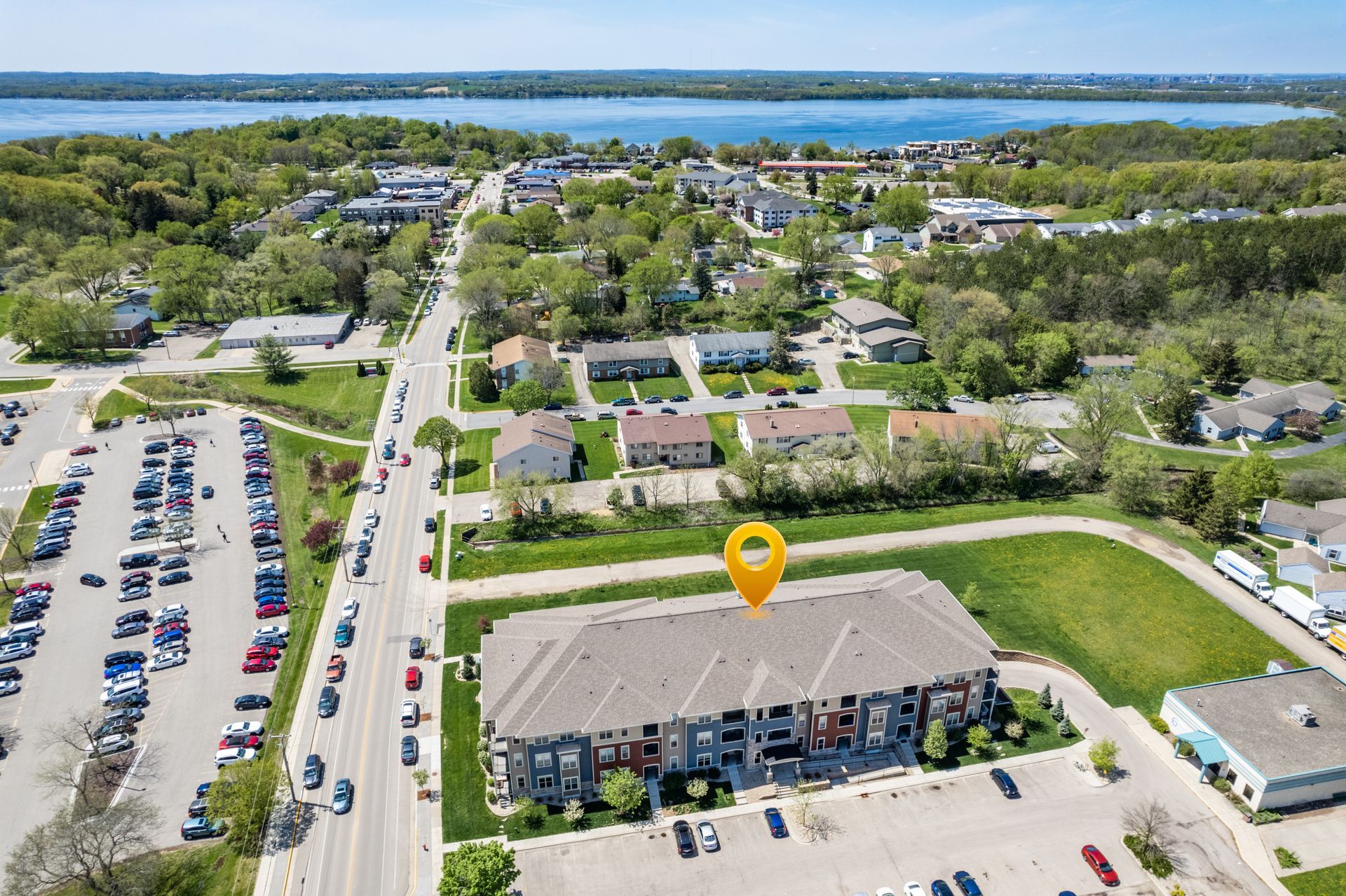 an aerial view of a building with a yellow pin pointing to it
