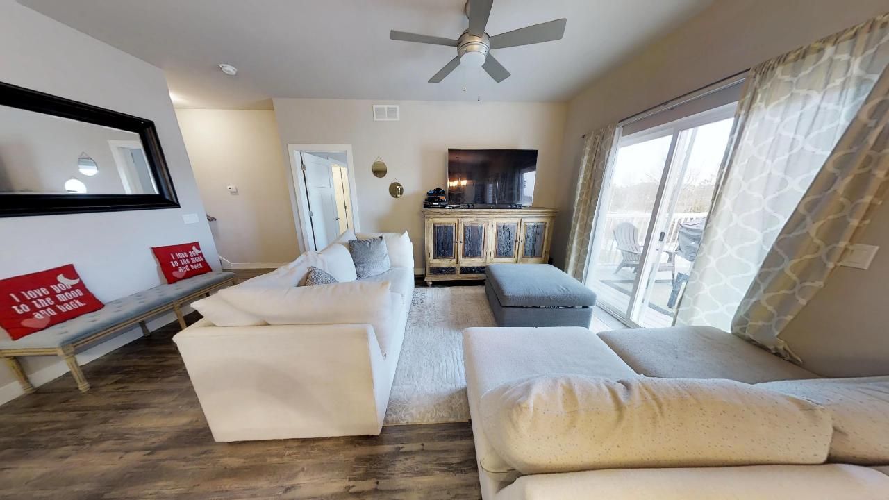 a living room with a couch that says i love you to the moon and back