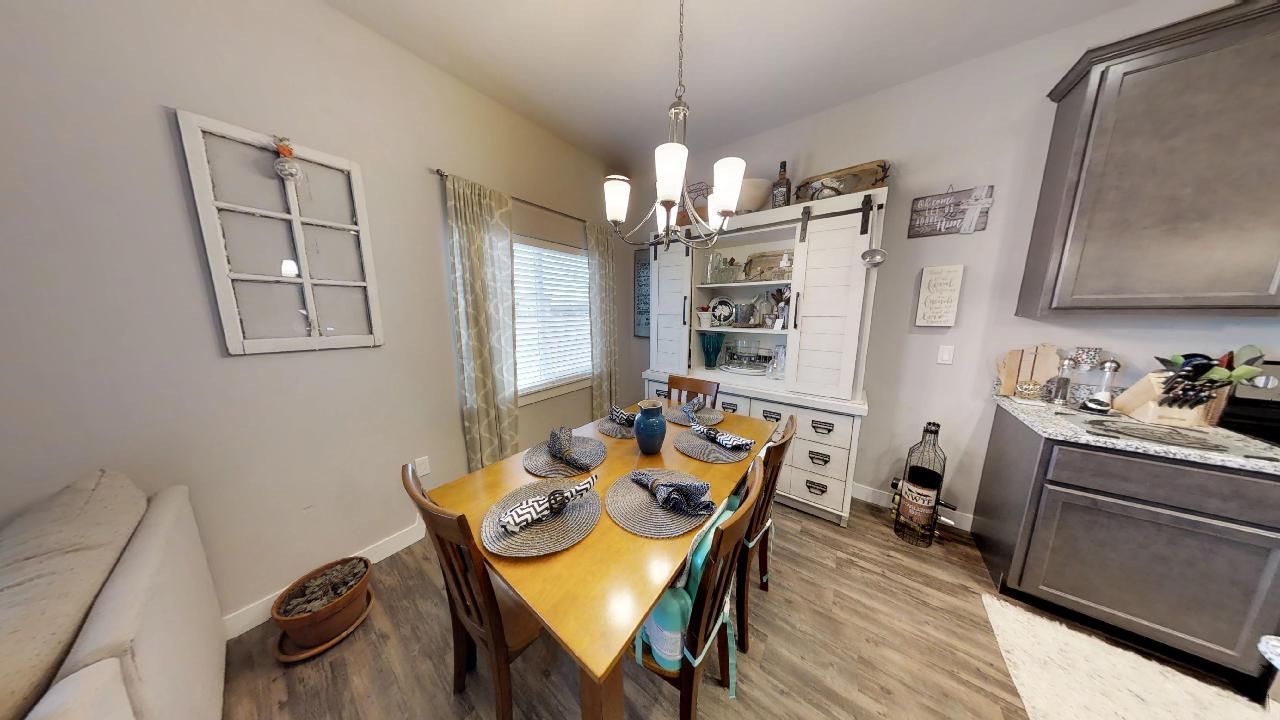 a dining room table with plates and napkins on it