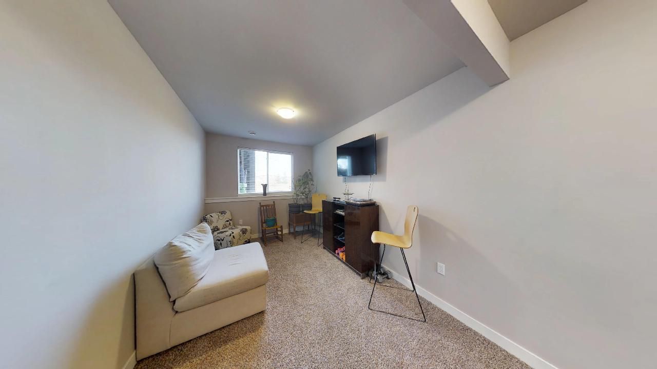 a living room with a couch and a flat screen tv