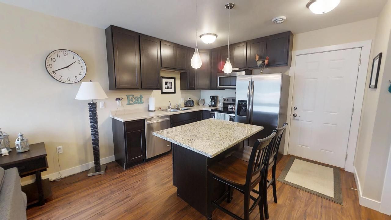 a kitchen with a sign that says eat on it