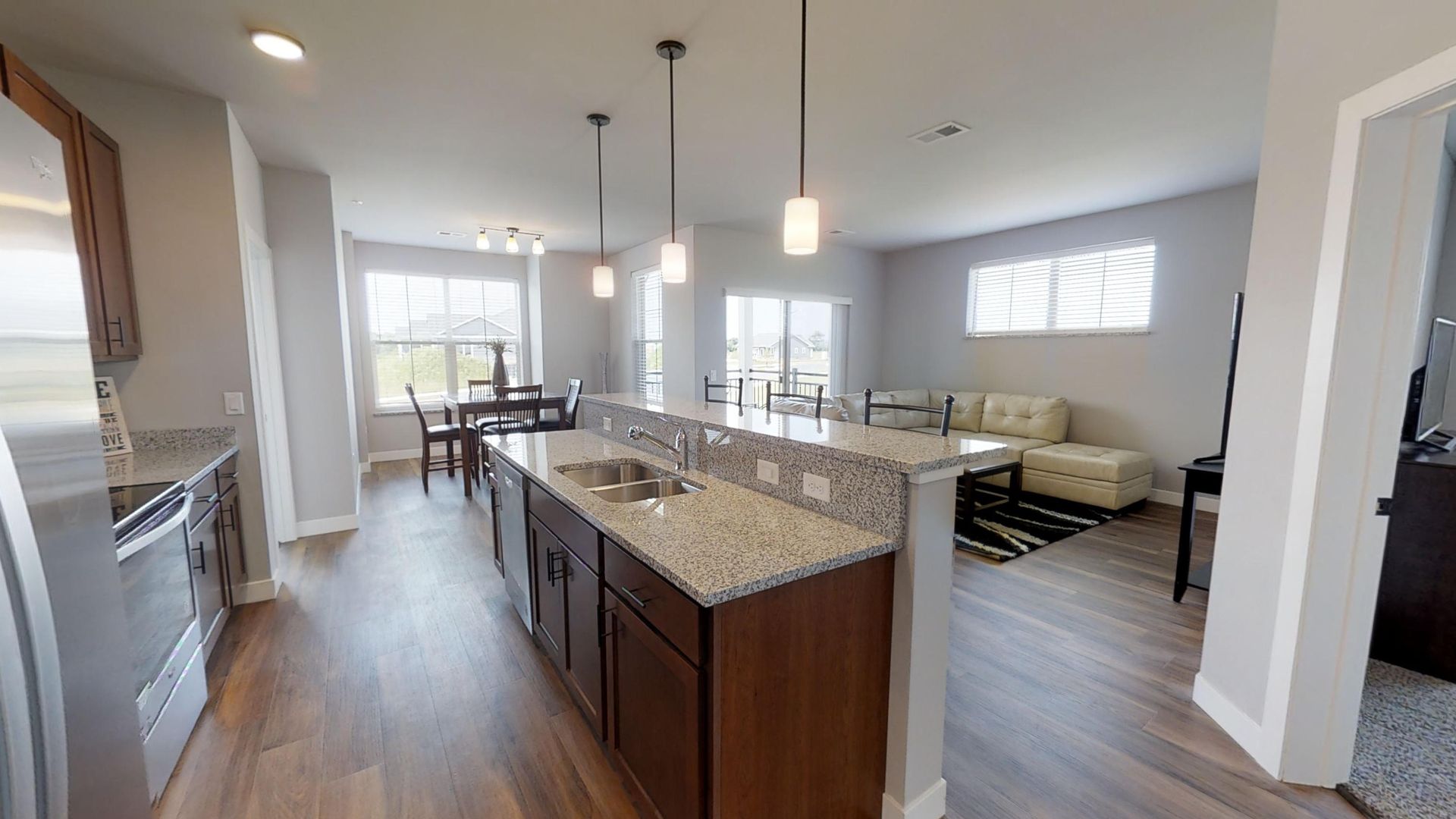 a kitchen with granite counter tops and stainless steel appliances