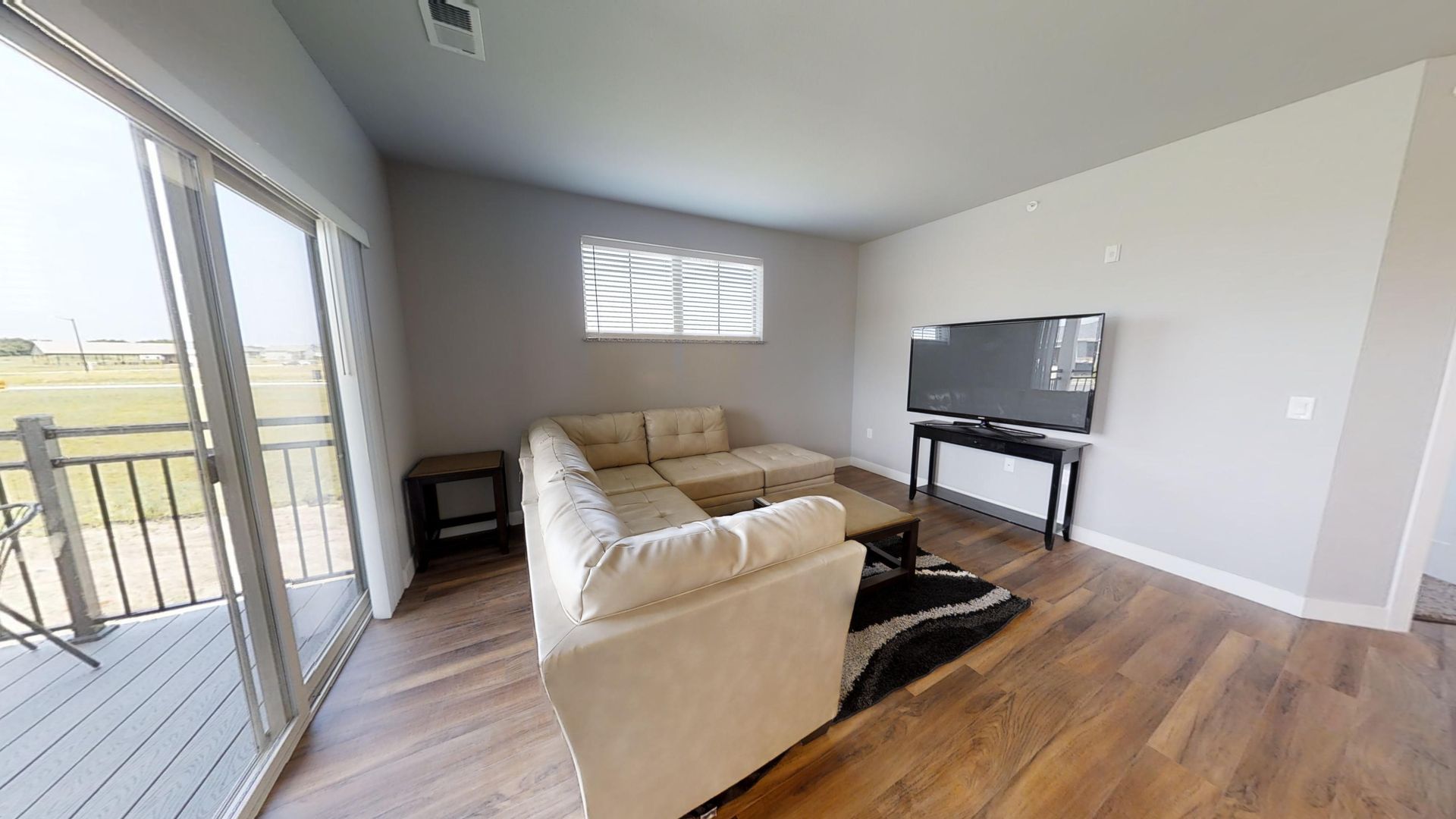 a living room with a couch and a flat screen tv