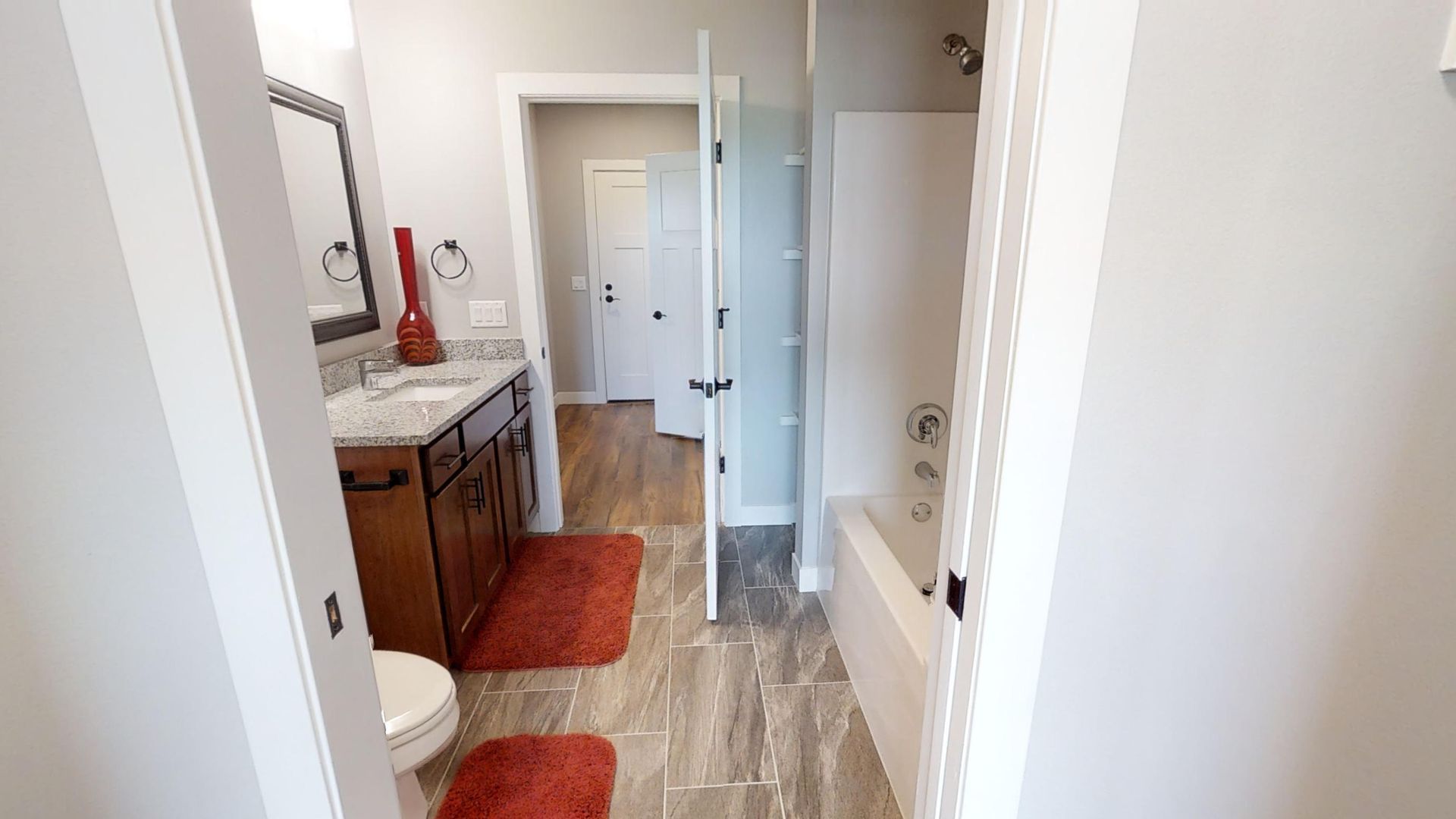 a bathroom with a toilet a sink and a bathtub