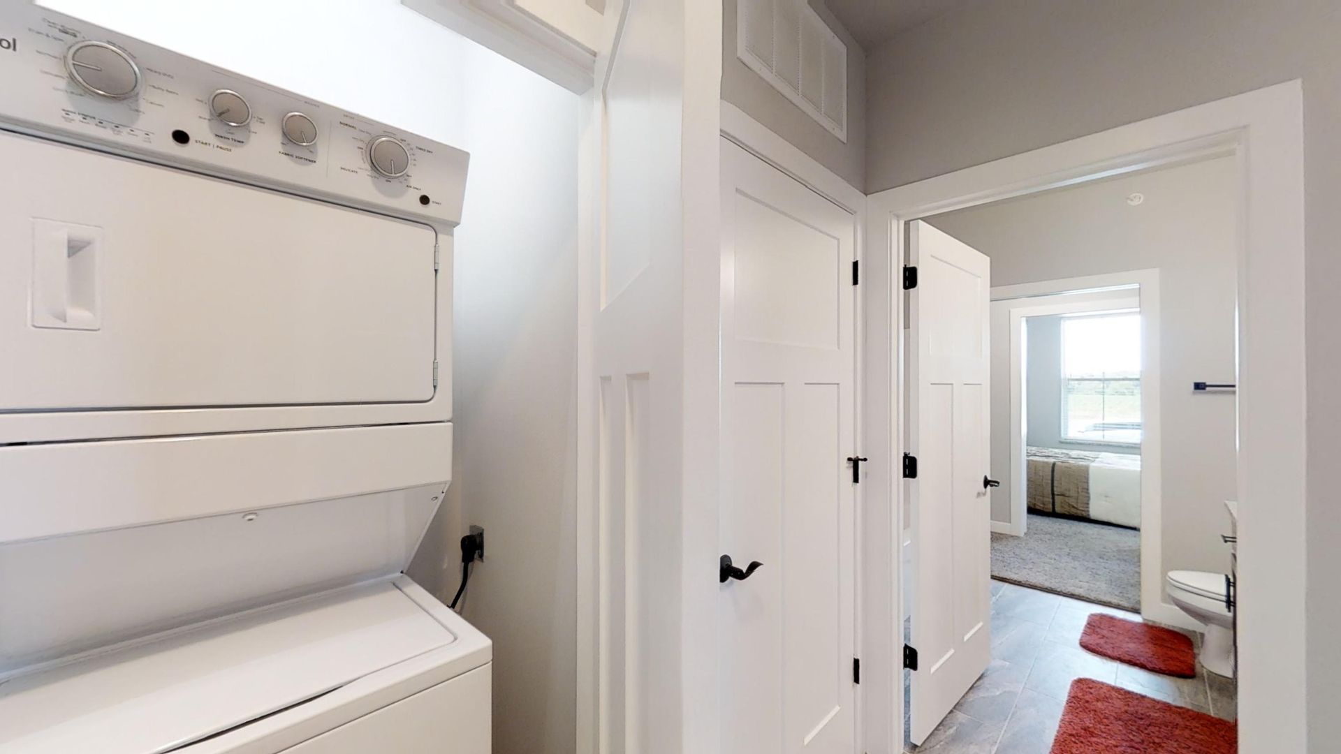 a whirlpool washer and dryer stacked on top of each other