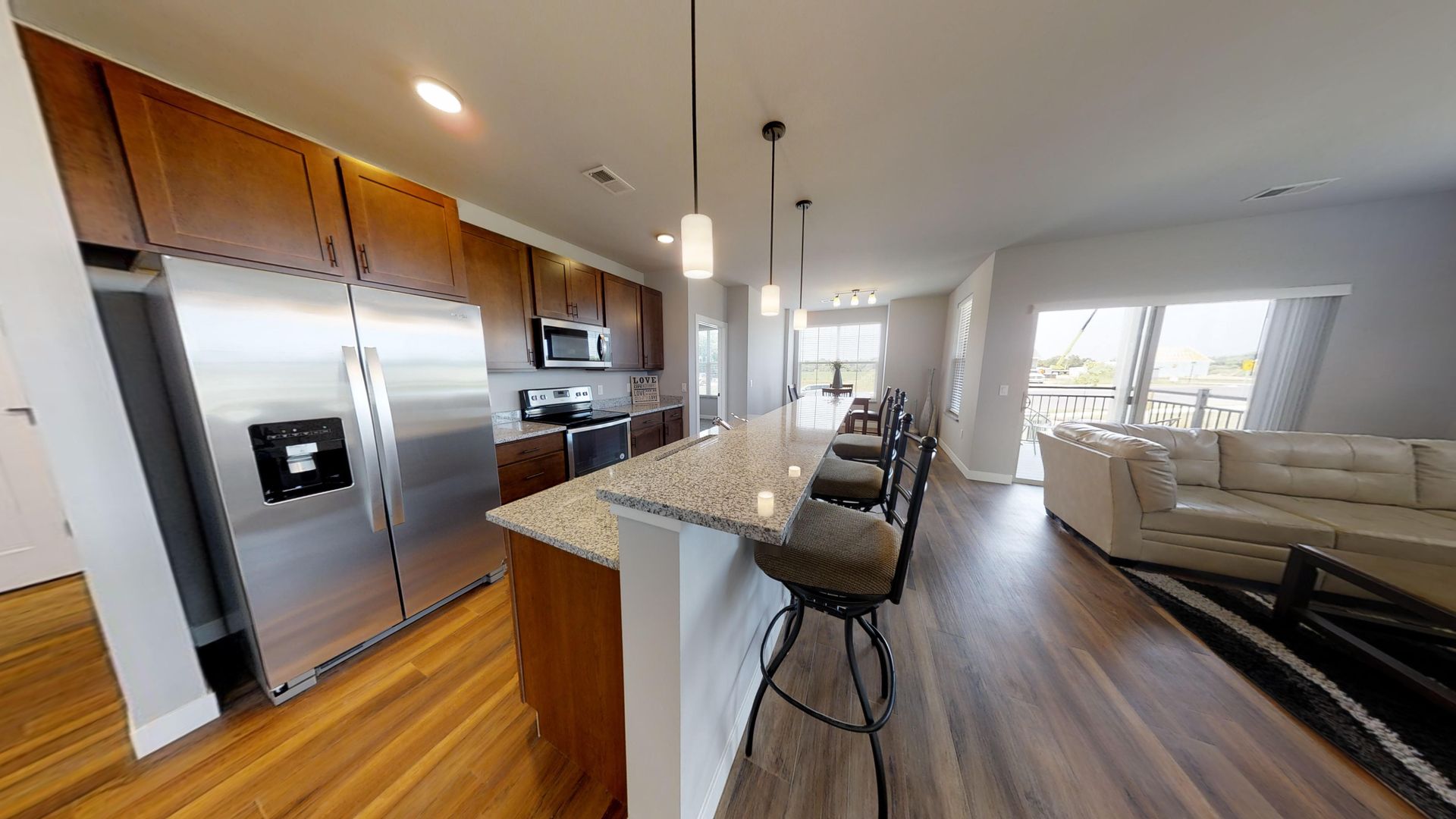 a kitchen with stainless steel appliances and granite counter tops