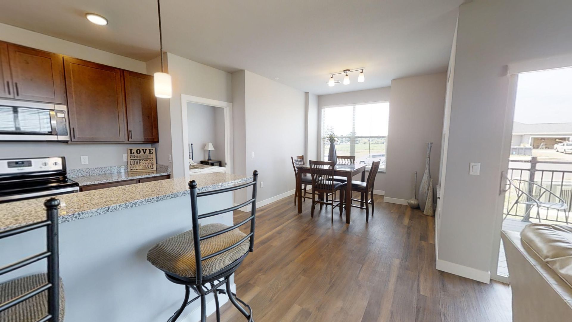 a kitchen with a sign that says love on it