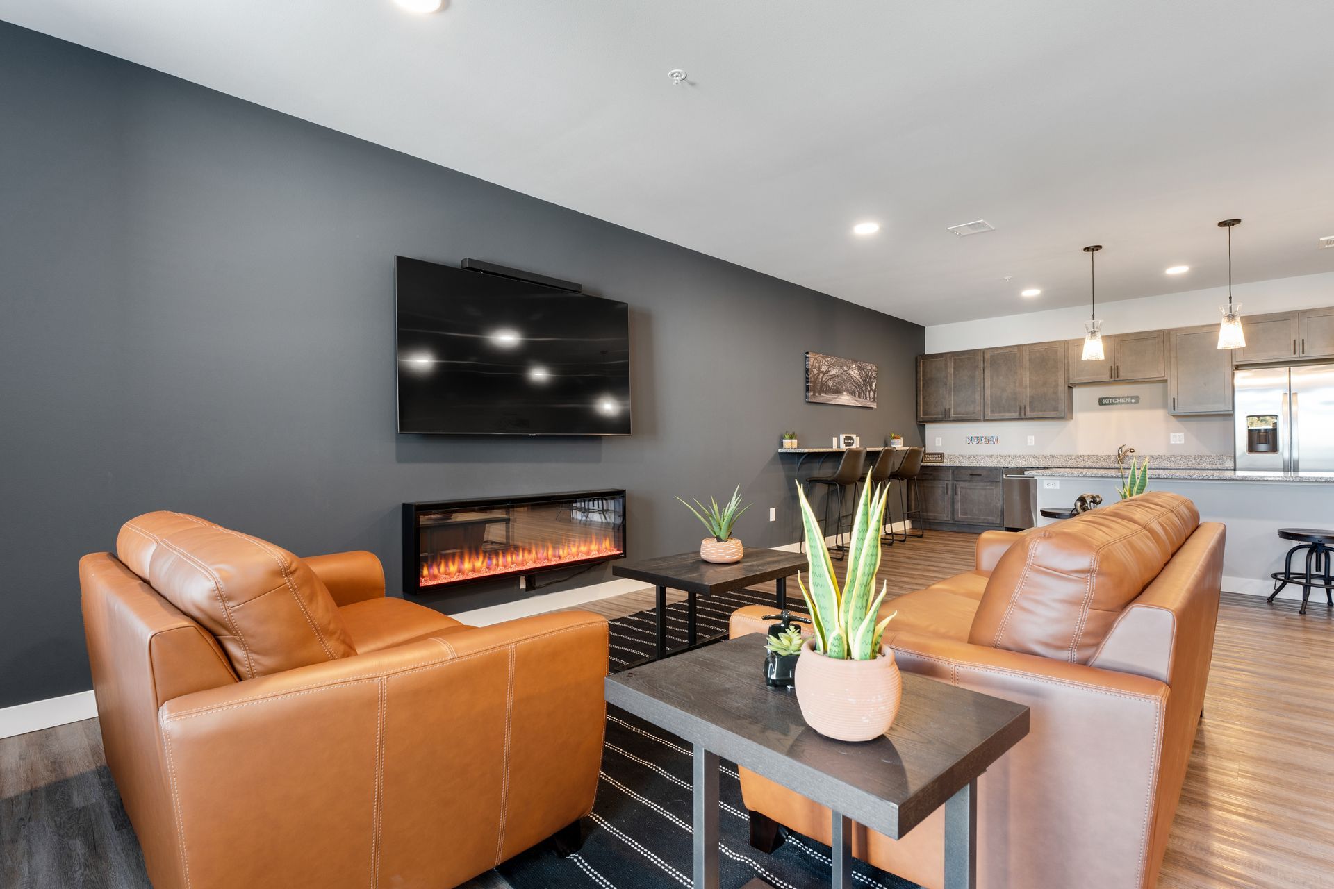 a living room with a fireplace and a flat screen tv