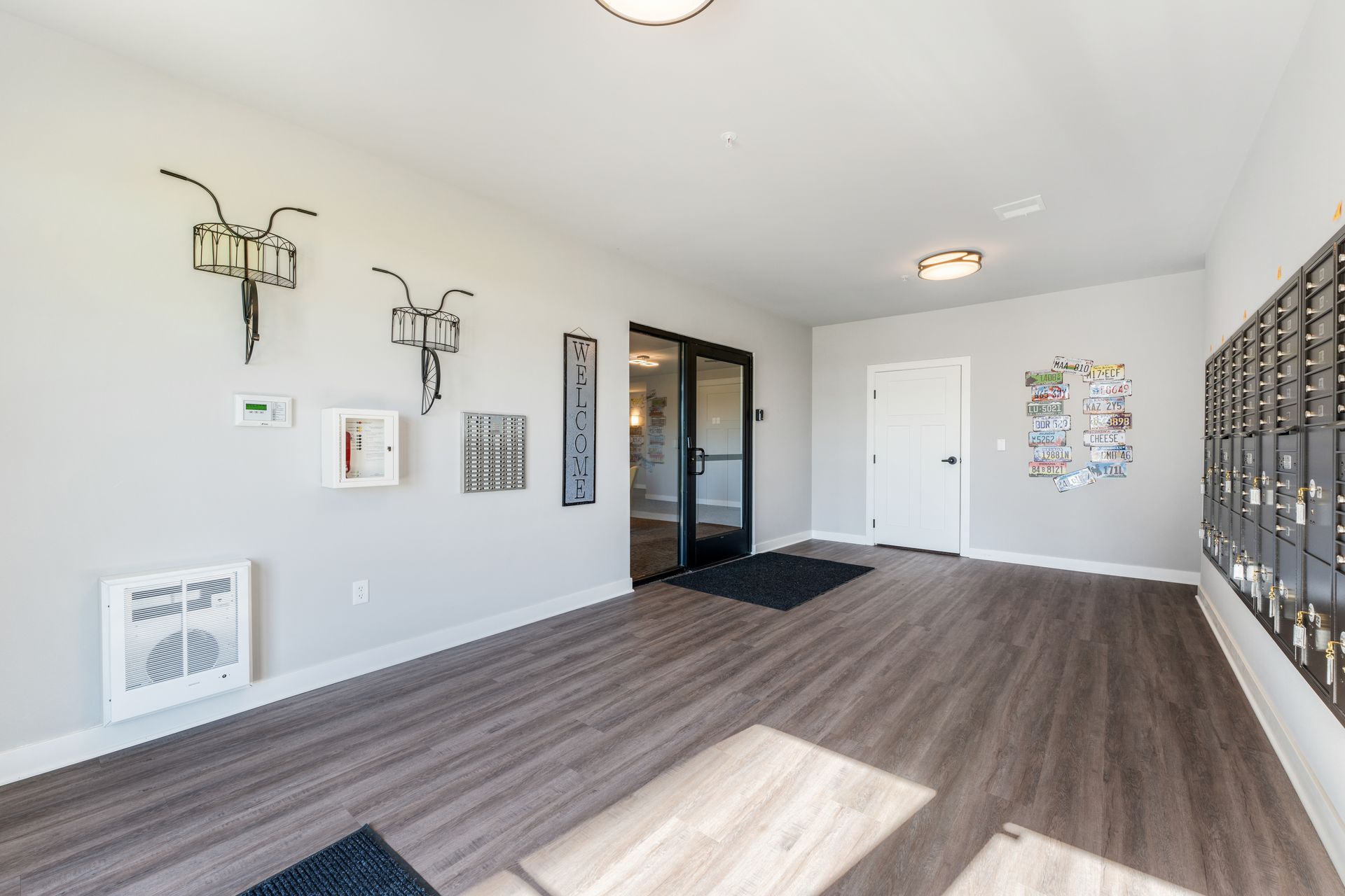 a hallway with a sign on the wall that says welcome