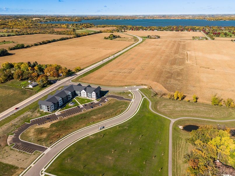 an aerial view of a residential area with a large building in the middle