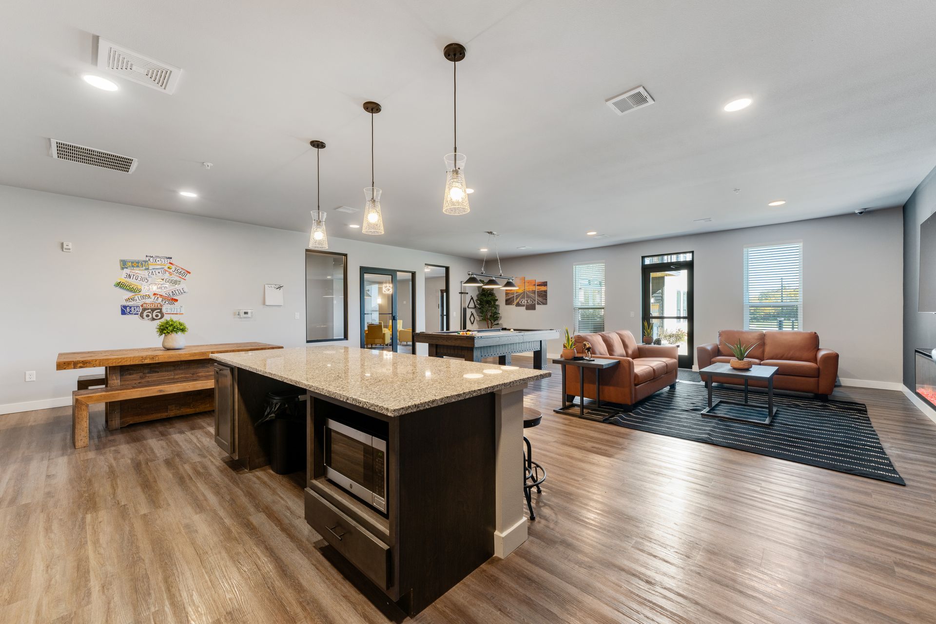 a living room with a couch and a pool table