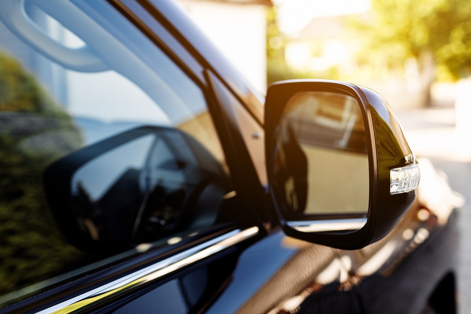 Auto Glass Mirror Replacement showing a newly installed side mirror on a black vehicle for improved visibility and safety. Auto Glass Mirror Replacement showing a newly installed side mirror on a black vehicle for improved visibility and safety.