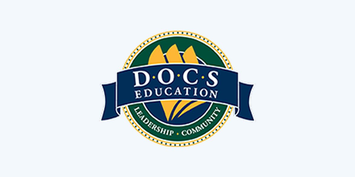 Logo of D.O.C.S Education, dark blue banner with white text, gold and green accents, includes the words Leadership and Community.