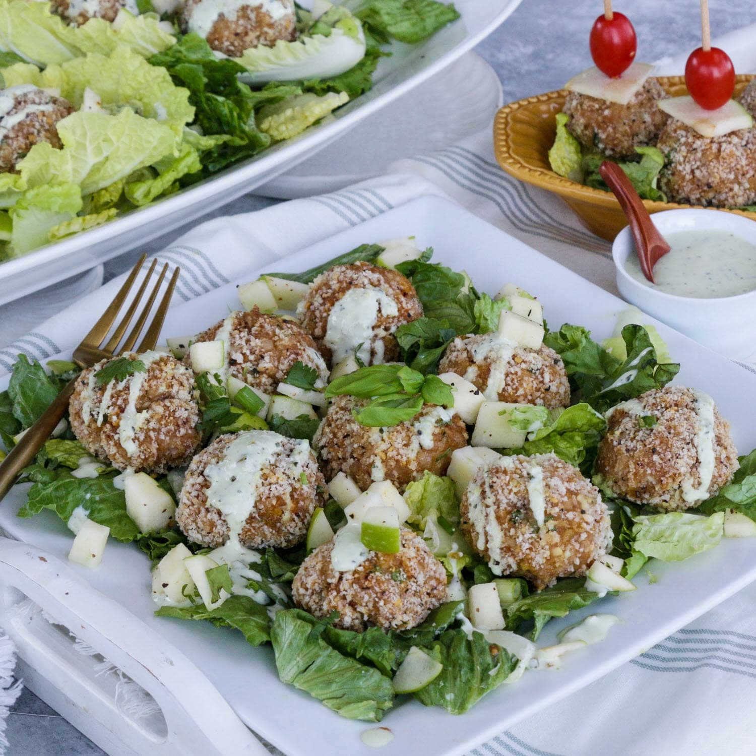 Apple Whiskey Barrel Smoked Chicken Meatballs on a bed of apple scallion salad