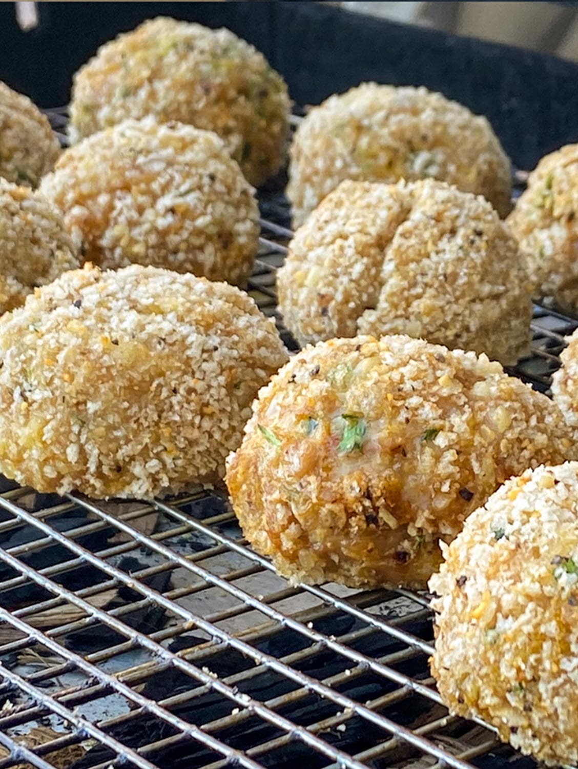Chicken meatballs cooking on grill