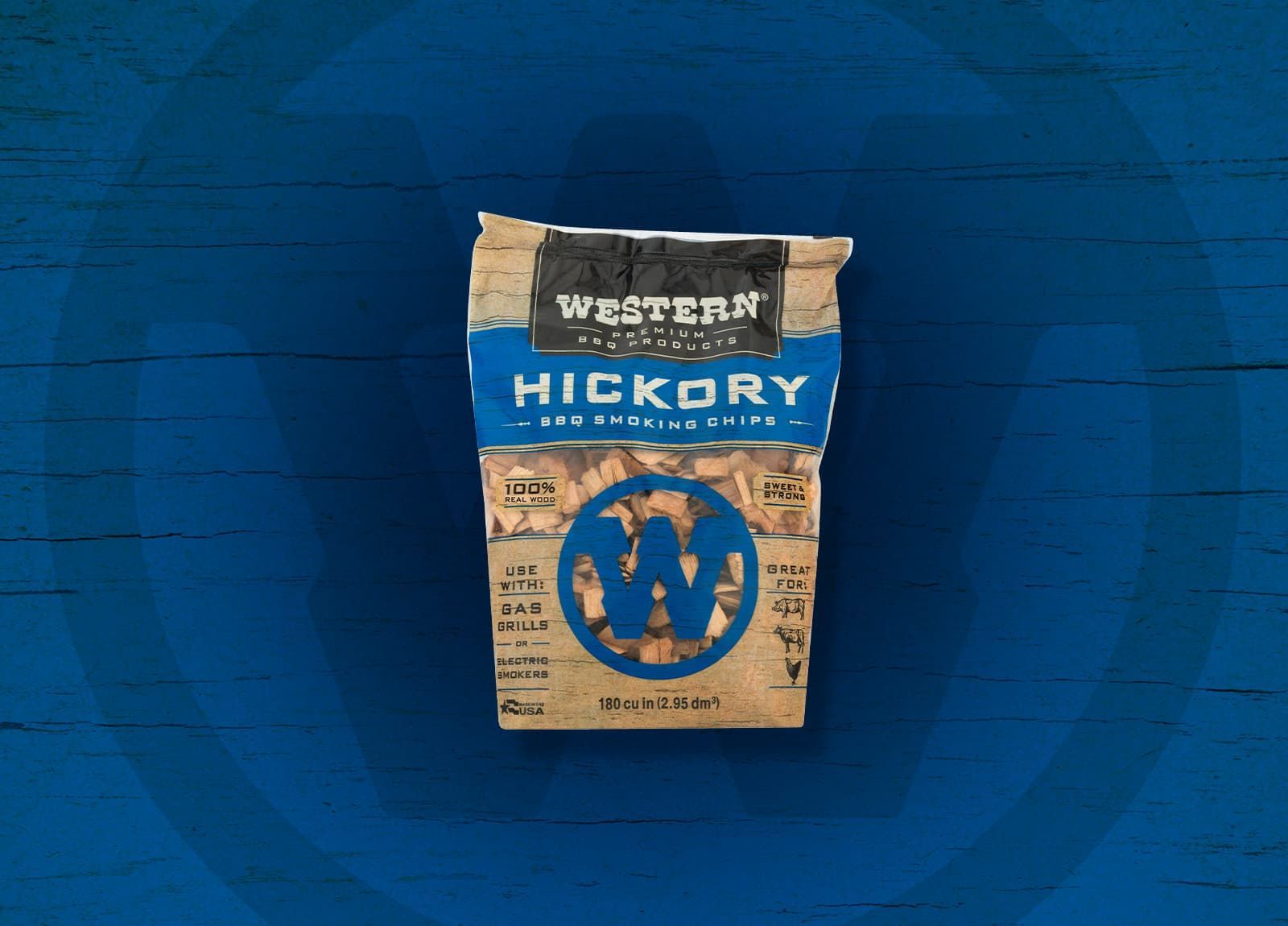 Bag of Western Hickory BBQ wood chips on a blue wooden surface.