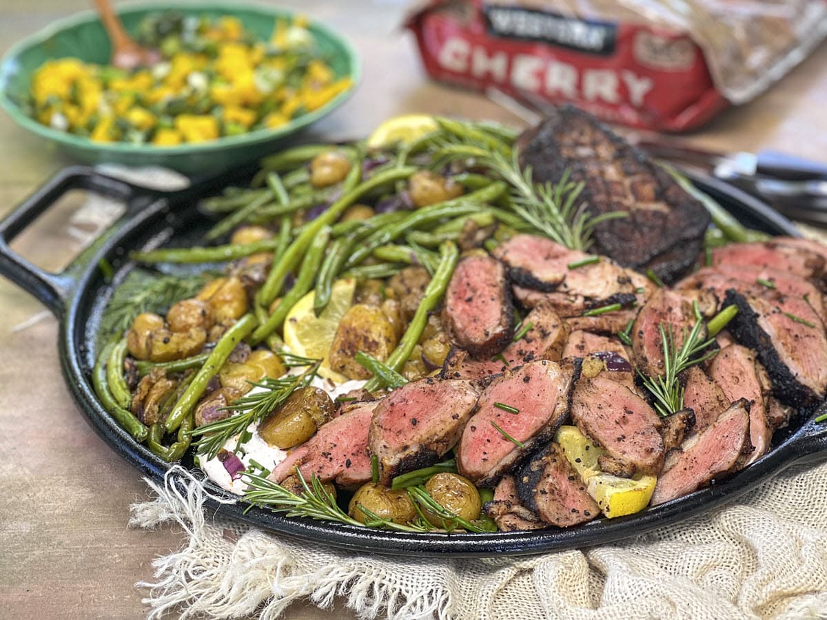 Plated sliced grilled duck breast with potatoes and green beans
