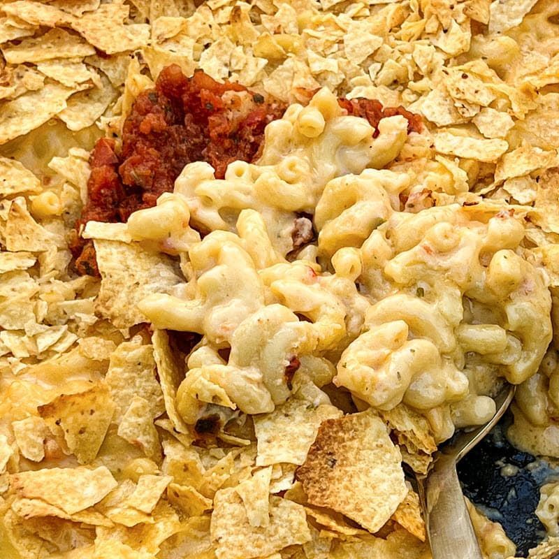 Closeup of a spoonful of pecan smoked salsa mac and cheese