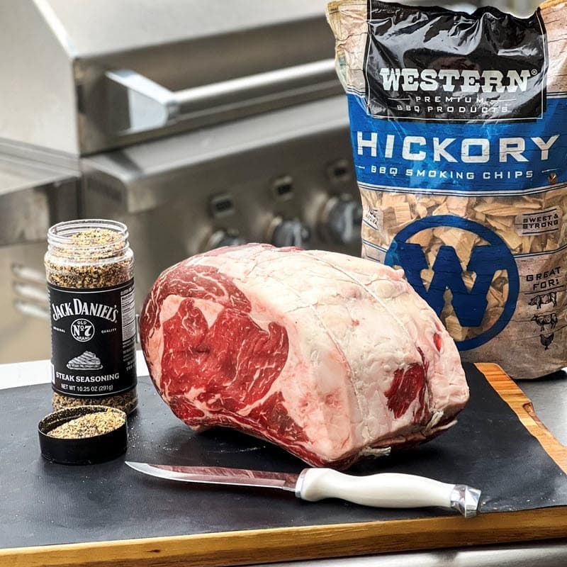 Whole ribeye roast with bag of Hickory chips and Jack Daniels Steak Seasoning