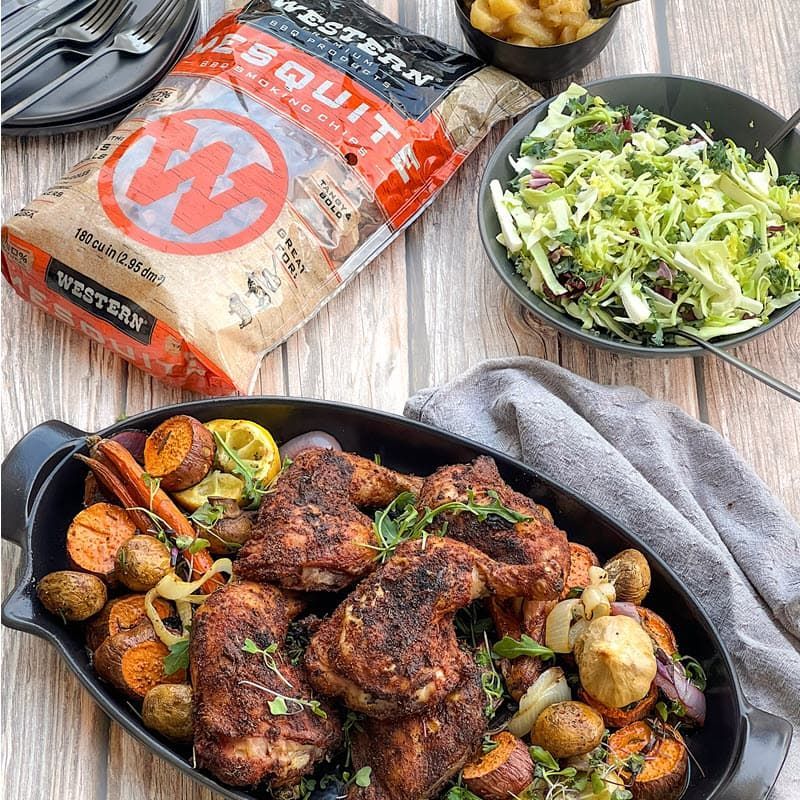 Plated veggies & Turkish chicken legs with coleslaw, applesauce and bag of Mesquite smoking chips