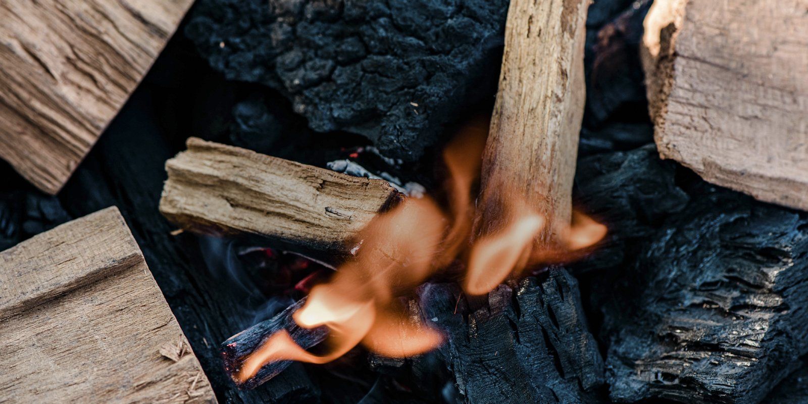 Flames ignite bbq cooking chips  
