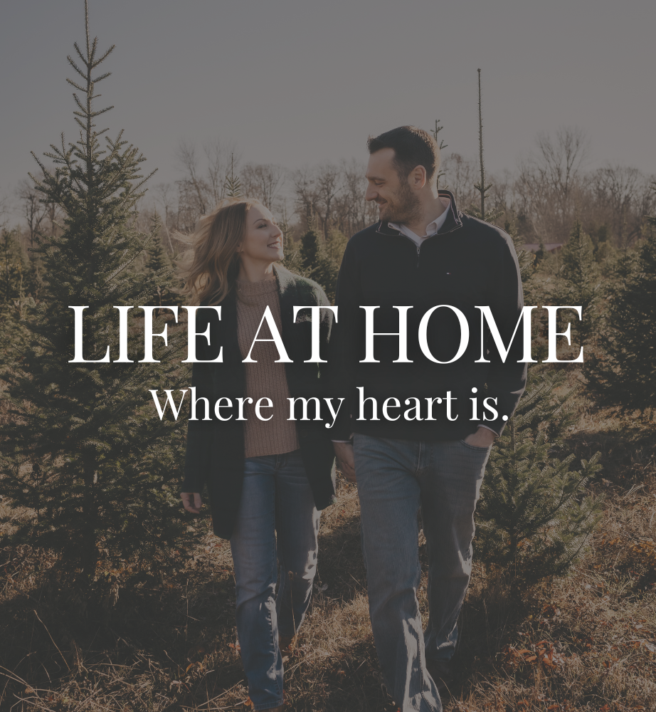 Couple walking through a Christmas tree farm with text: “LIFE AT HOME, Where my heart is.”